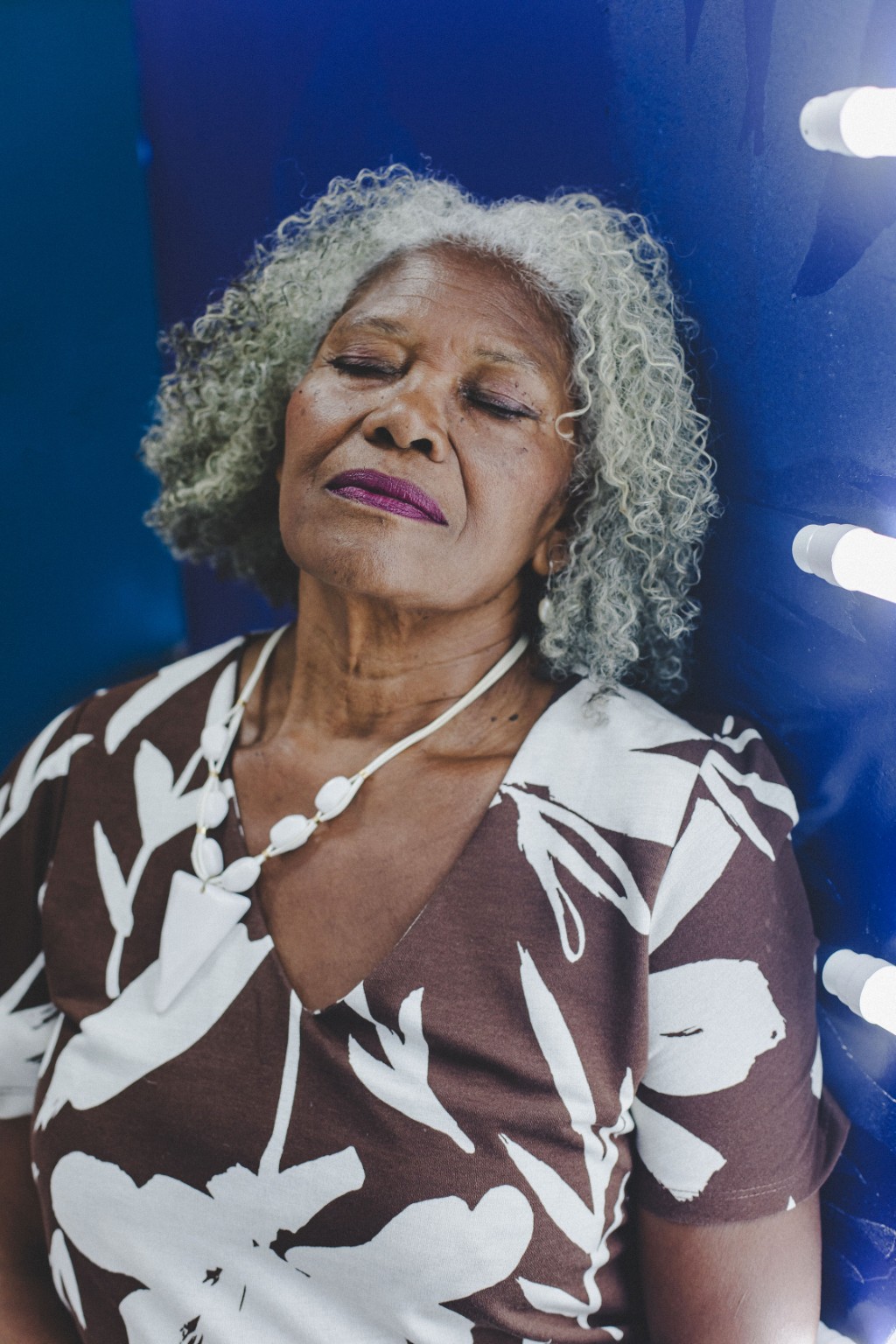 An older woman resting in warm light